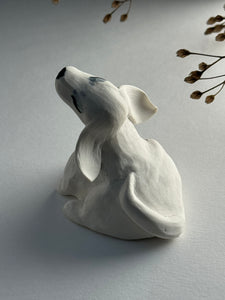 Small porcelain dog figurine